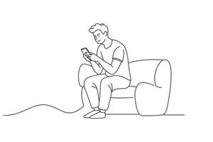 The young man is sitting on the sofa checking the message on his cell phone One line continuous line art illustration on white background. vector