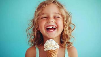 A little girl is smiling while holding an ice cream cone photo