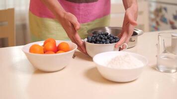 Chef arranging fresh ingredients on kitchen counter for baking video