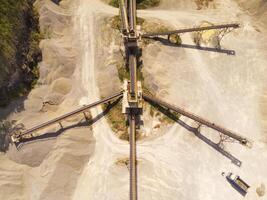 Bird eye view of sand mining conveyor from a height of 200 meters. Mining Industry. Panoramic Landscape. Graphic Resources. Above. Drone Photography. Aerial Landscape Photography Concept photo