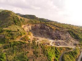 Aerial View of an industrial site on a mountain slope. Mining Industry. Panoramic Landscape. Graphic Resources. Mines and sand pits. Aerial Landscape Photography Concept photo