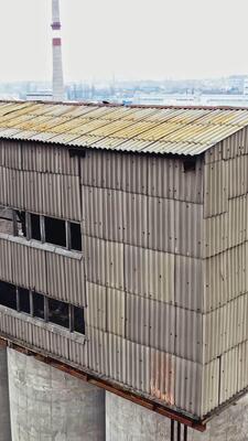 Flight over the empty old plant almost ruined in the city after 