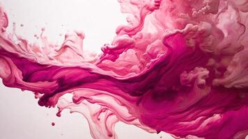 Pink ink spreads in water. photo