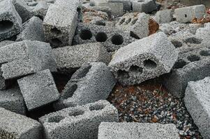 a pile of cinder blocks on a construction site. photo