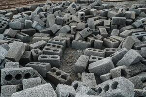 a pile of cinder blocks on a construction site. photo