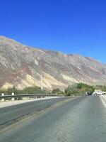 Empty road on the way to the Andes from Salta, Argentina photo