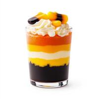Closeup of a Halloween themed candy corn parfait with layers of colored mousse isolated on white background photo