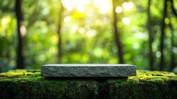 Stone podium on a moss covered rock platform with a green forest background, sunlight filtering through the trees, and blurred foliage photo