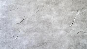Angled shot of a rough concrete wall with irregular patterns and stains varied gray shades with subtle warm undertones ideal for industrial and modern backgrounds photo