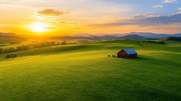 Aerial view of a rustic ranch with sprawling green pastures a classic red barn and grazing cattle under a vibrant sunset sky photo