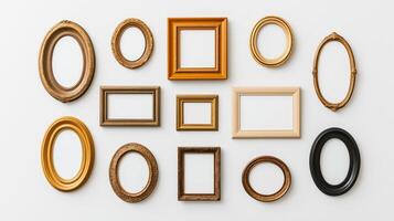 Overhead view of a collection of vintage ornate picture frames in various shapes including oval round and rectangular arranged on a white background empty and ready for use photo