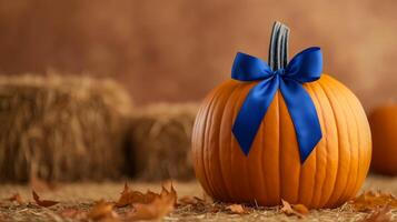 Closeup of a winning pumpkin with a blue ribbon attached featuring an artistic intricate carving set against a backdrop of hay bales and autumn leaves photo