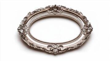 Side view of a vintage oval picture frame with a delicate lace like pattern and a slightly tarnished silver finish isolated on a white background with soft diffused shadows photo