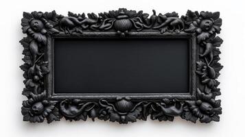 Top down shot of a rectangular Halloween style frame with intricate carvings of witches cauldrons and black cats in a dark vintage finish isolated on a white background photo