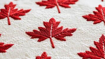 Soft white fabric with red maple leaf embroidery Canadian Thanksgiving cozy and patriotic simple but warm suitable for autumn themes photo