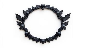 Top view of a circular Halloween frame with gothic inspired bat wings and skulls around the edges finished in dark distressed metal isolated on a white background photo