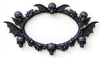 Top view of a circular Halloween frame with gothic inspired bat wings and skulls around the edges finished in dark distressed metal isolated on a white background photo