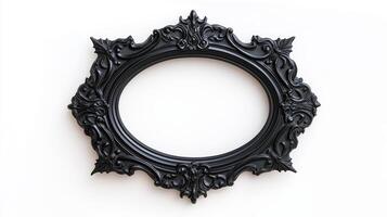 Overhead view of a Halloween style picture frame with ornate black gothic designs featuring spider webs and bat motifs isolated on a white background with soft shadows photo