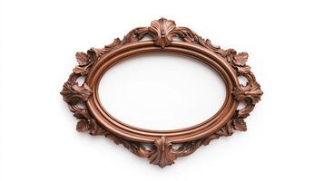 Wide angle shot of a vintage oval shaped picture frame with elaborate carvings and patina featuring baroque style scrolls and leaves isolated on a pure white background photo