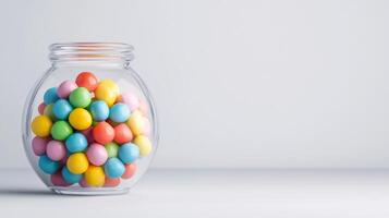 Conceptual image of a bubble gum machine dispensing bright colorful gum balls isolated on a solid white background with sharp clean lines photo