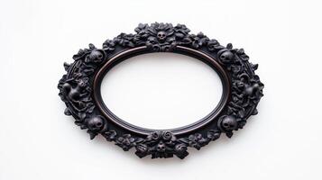 Overhead view of an oval Halloween style picture frame with intricate carvings of witches black cats and moons finished in a dark eerie patina isolated on a white background photo