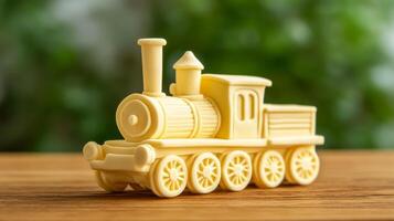 Close up of a whimsical butter sculpture of a vintage train engine complete with wheels and a smokestack placed on a wooden table rich yellow tone textured details photo