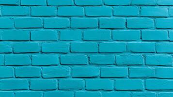 Closeup of a textured painted brick wall in vibrant turquoise showing rough brush strokes and slightly uneven coverage perfect for a bold and modern design aesthetic photo