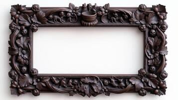 Top down shot of a rectangular Halloween style frame with intricate carvings of witches cauldrons and black cats in a dark vintage finish isolated on a white background photo