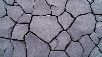 Macro shot of a raw concrete surface showing intricate pores and fine cracks rough texture with subtle shadow details monochromatic gray tones for industrial aesthetics photo