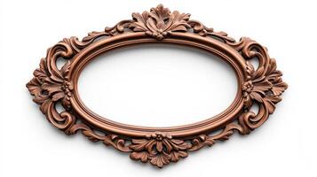 Wide angle shot of a vintage oval shaped picture frame with elaborate carvings and patina featuring baroque style scrolls and leaves isolated on a pure white background photo