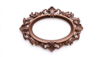Wide angle shot of a vintage oval shaped picture frame with elaborate carvings and patina featuring baroque style scrolls and leaves isolated on a pure white background photo