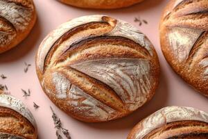 Freshly Baked Artisan Bread Loaves with Rustic Crust on a Light Background photo