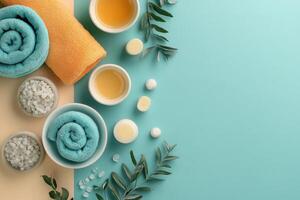 Spa and Wellness Concept with Towels, Bath Salts, Essential Oils, and Greenery on a Pastel Background photo