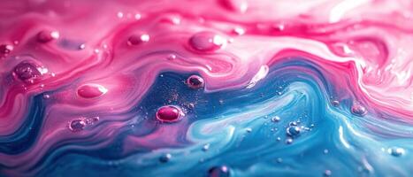 Abstract Fluid Art with Pink and Blue Swirls and Droplets Creating a Dreamy and Ethereal Effect photo