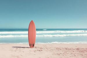 Vibrant Orange Surfboard Standing Upright on a Serene Sandy Beach with Gentle Ocean Waves in the Background photo