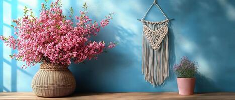 Beautiful Spring Floral Arrangement with Macrame Wall Hanging on Blue Background photo
