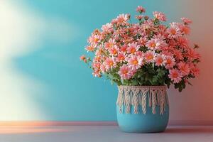 Beautiful Bouquet of Pink Daisies in a Blue Vase with Macrame Decor Against a Colorful Gradient Background photo