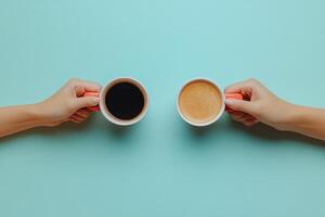 Two Hands Holding Coffee Cups Against a Light Blue Background - Minimalist and Modern Beverage Concept photo