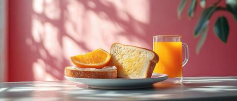 Fresh Breakfast with Orange Juice and Toast on a Sunny Morning with Pink Background photo