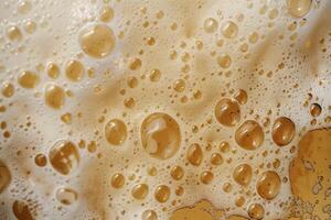 Closeup of beer bubbles creating an abstract pattern with a golden color palette photo