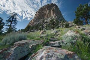 Wideangle view of devils tower national monument under a clear blue sky photo