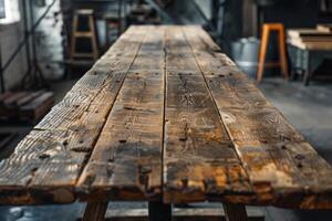 Closeup of a textured wooden table in a craftsman's workshop photo