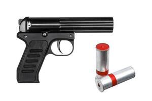 Black signal Flare gun and cartridges of a signal rocket isolated on white photo