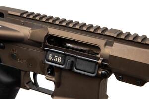 Modern automatic rifle in bronze color. Weapons for police, special forces and the army. Assault rifle on white back. Automatic carbine. photo