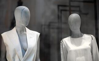 Two mannequins in a shop window. Modern mannequin for displaying clothes. photo