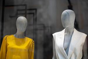 Two mannequins in a shop window. Modern mannequin for displaying clothes. photo