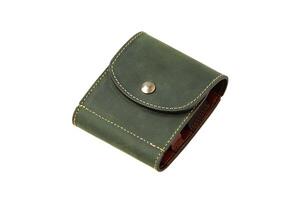 Leather wallet isolated on white background. Luxury leather wallet on a rivet button on a light back. Green leather wallet. photo
