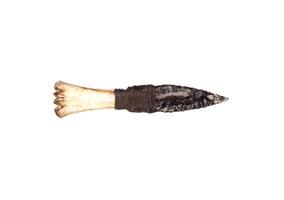 Obsidian knife with bone handle isolate on a white back. Prehistoric weapon made of volcanic glass. photo