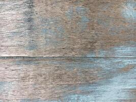 Wooden texture with a crack and blue paint photo