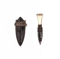 Obsidian knife with bone handle isolate on a white back. Prehistoric weapon made of volcanic glass. photo